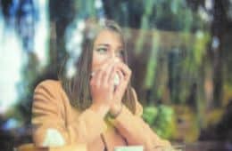 Woman Sneezing because of Allergy